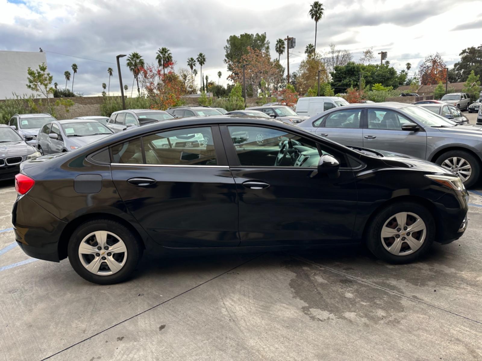 2017 Black /BLACK Chevrolet Cruze LS Auto (1G1BC5SM6H7) with an 1.4L L4 DOHC 16V TURBO engine, 6A transmission, located at 30 S. Berkeley Avenue, Pasadena, CA, 91107, (626) 248-7567, 34.145447, -118.109398 - Crown City Motors is a used “Buy Here Pay Here” car dealer in Pasadena CA. “Buy Here Pay Here” financing, means that when you purchase your vehicle from our dealership, that you make the payments to the dealership as well. We do not need the banks approval to get you approved for a used auto - Photo #5